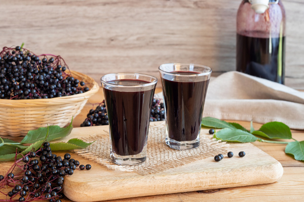 15 Immune Boosting Elderberry Recipes | If you’re looking for healthy natural remedies to boost your immune system, elderberry is about to become your new BFF. Click to learn the health benefits of elderberry, how to cook with elderberry, and our favorite elderberry recipes! From elderberry syrup, teas, and jam, to homemade gummies, cough drops, and lollipops, these cold, flu, and allergy fighting ideas will help you and your kids feel better sooner! #elderberry #elderberryrecipes #immunity