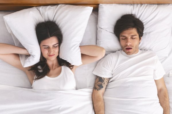 How to Stop Snoring | if you're looking for tips, natural remedies, and products that can help you or your spouse stop snoring fast, we're sharing 10 simple ideas to help. Perfect for women, men, and even kids, these snoring solutions and treatment options will offer relief to you and your partner so everyone can get a good night of sleep. Find out the common causes of snoring, the best prevention tips, and store bought products that work!